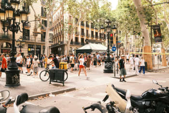 A busy city street filled with lots of people